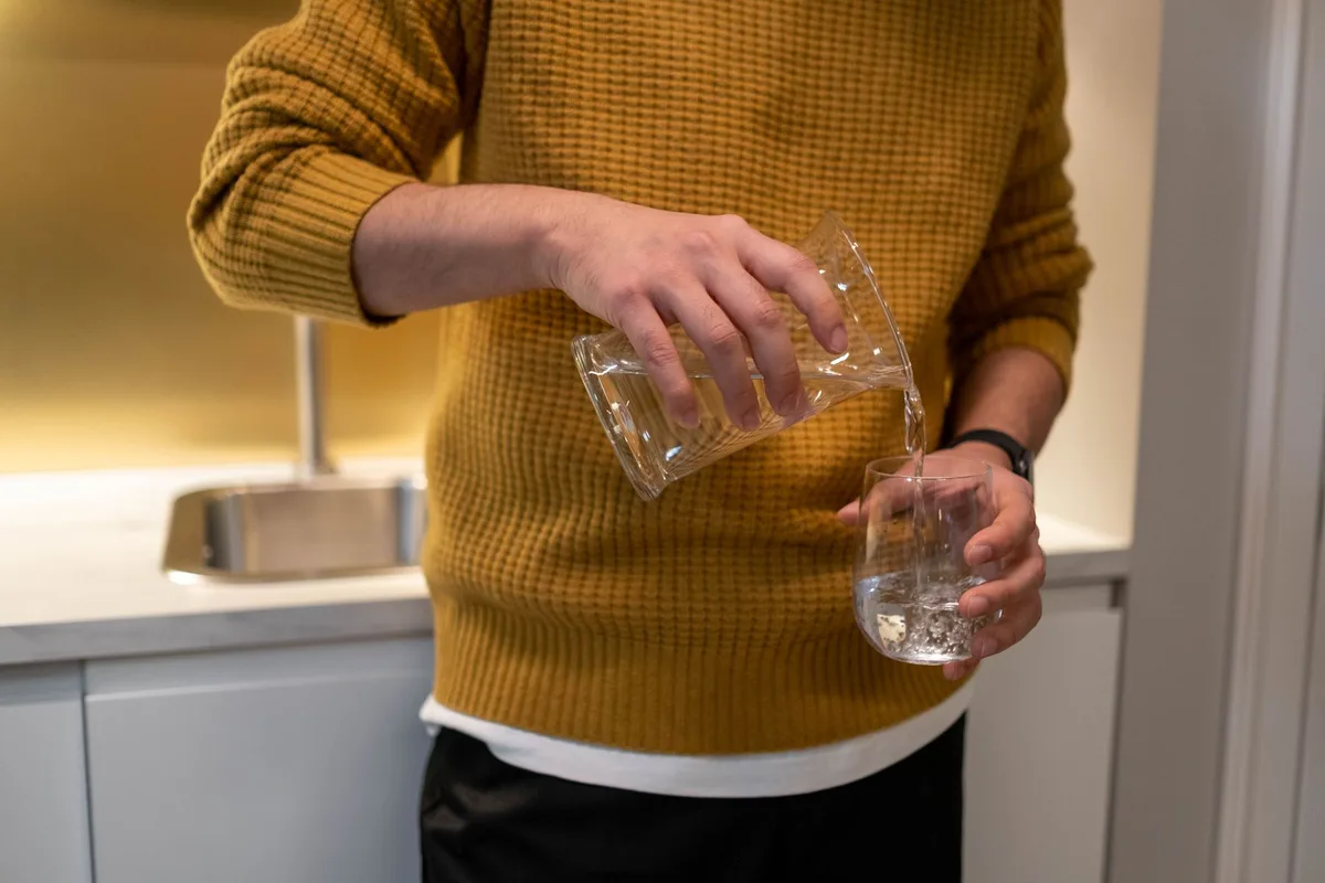 user checking water taste